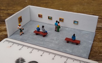 a miniature art gallery full of tiny people