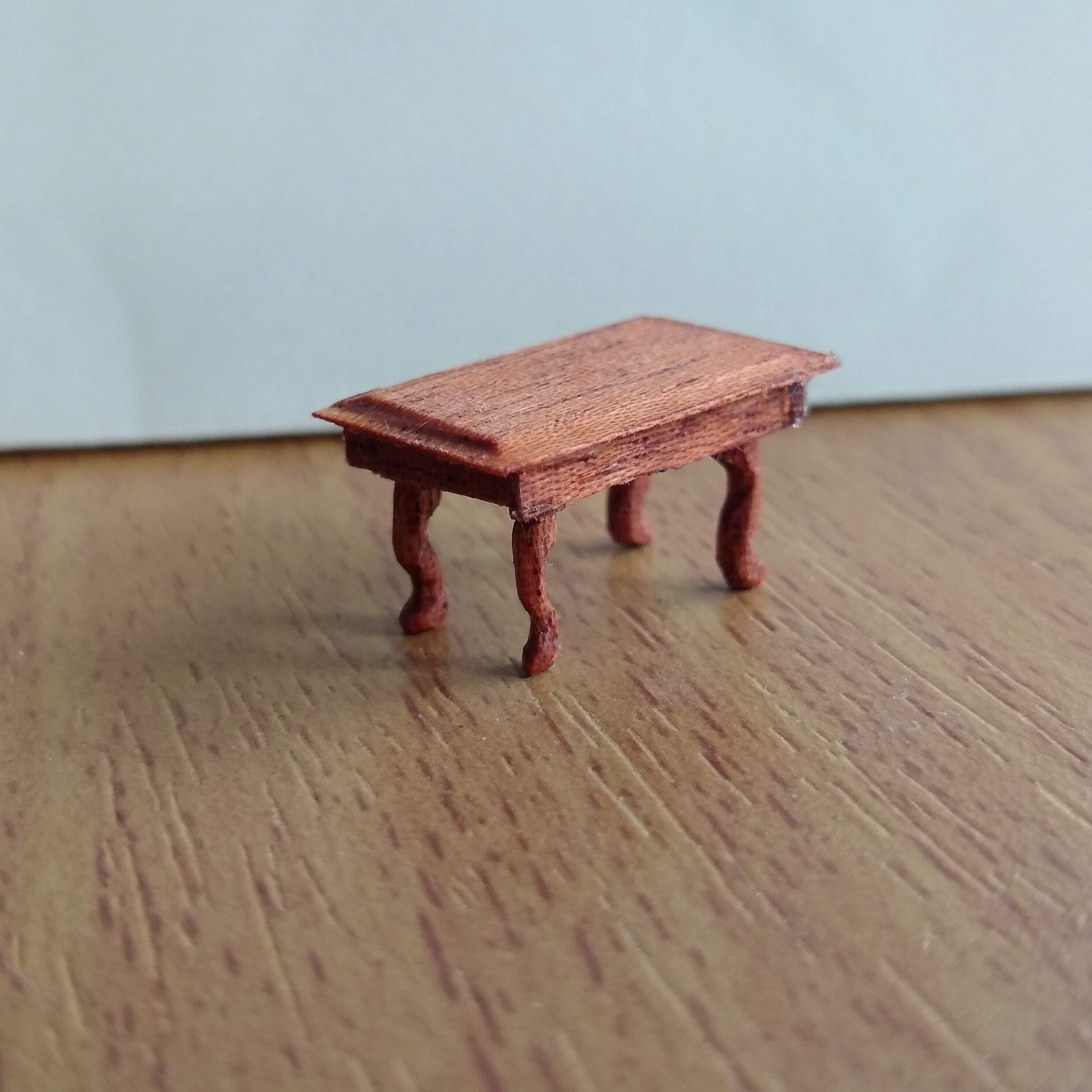 Handcarved quarter scale mahogany wood coffee table.
