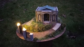 A spooky model of a mauseleum at night