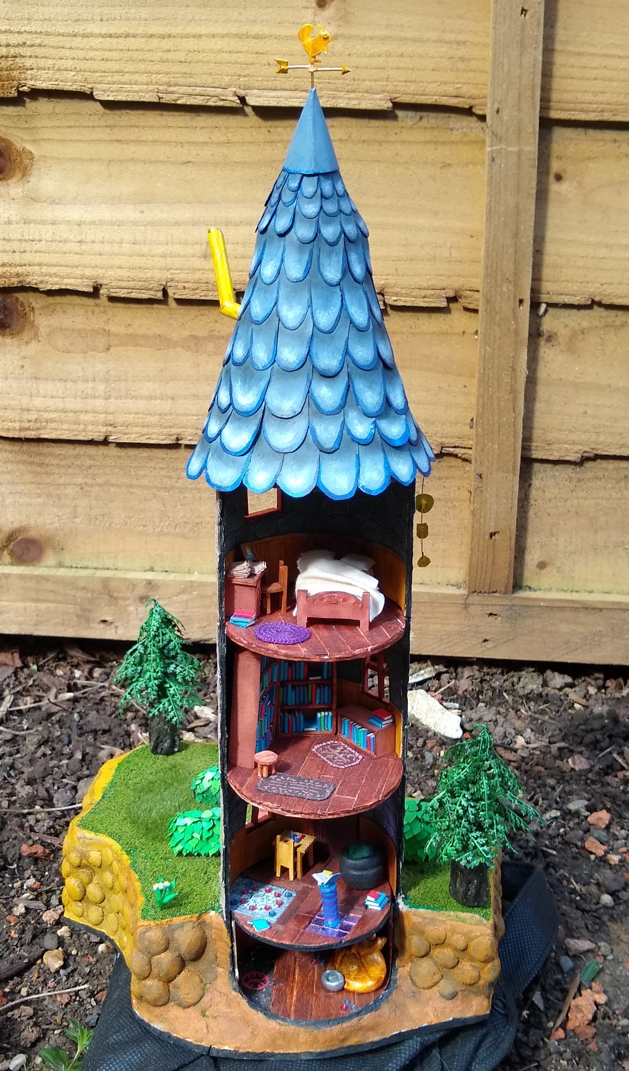 The previous wizard tower model but from the back which shows a cutaway view of the interior